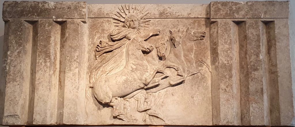 A relief of the Greek sun god, Helios. Gold may have gotten its name from a Latin word that was associated with the Roman goddess of the dawn.