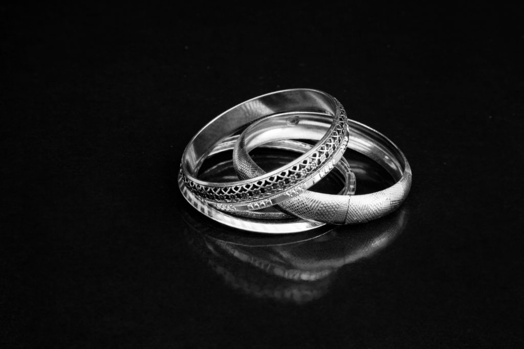 Jewelry made of precious metals, specifically silver.