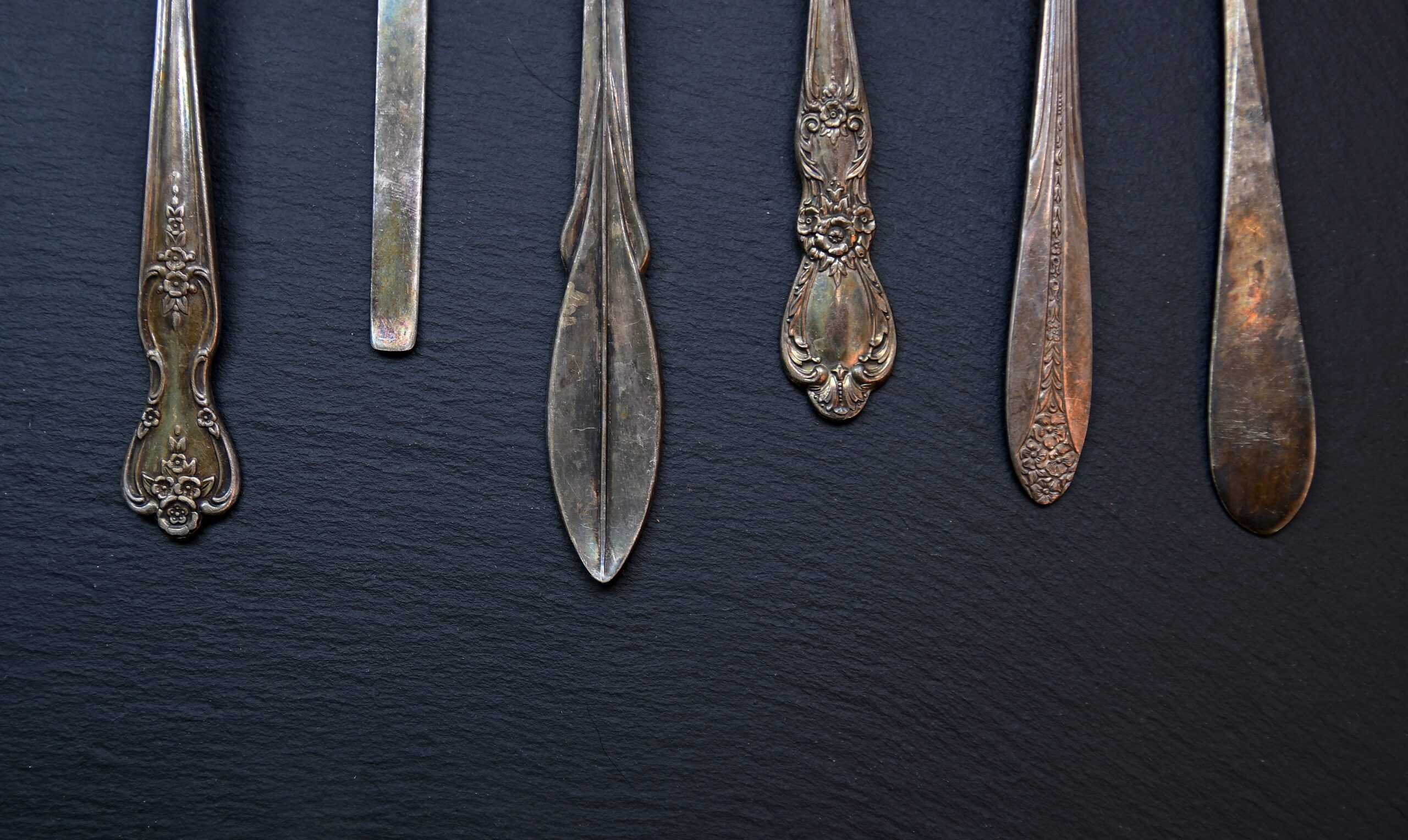 Ends of sterling silver utensils.
