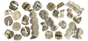 A collection of gold crowns and bridges ready to be refined