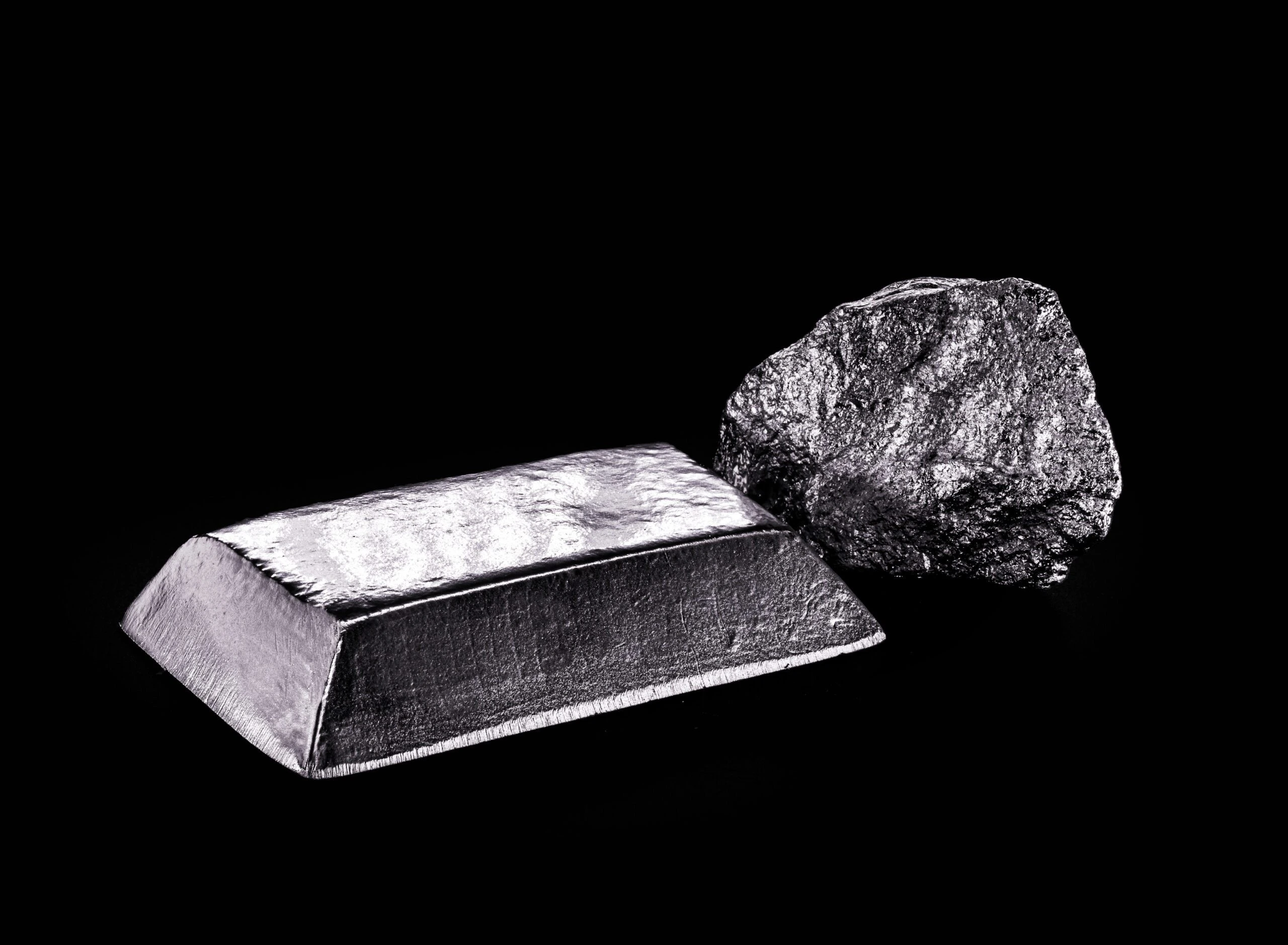 palladium stone and ingot, a transition metal used in the production of aerospace equipment, black background