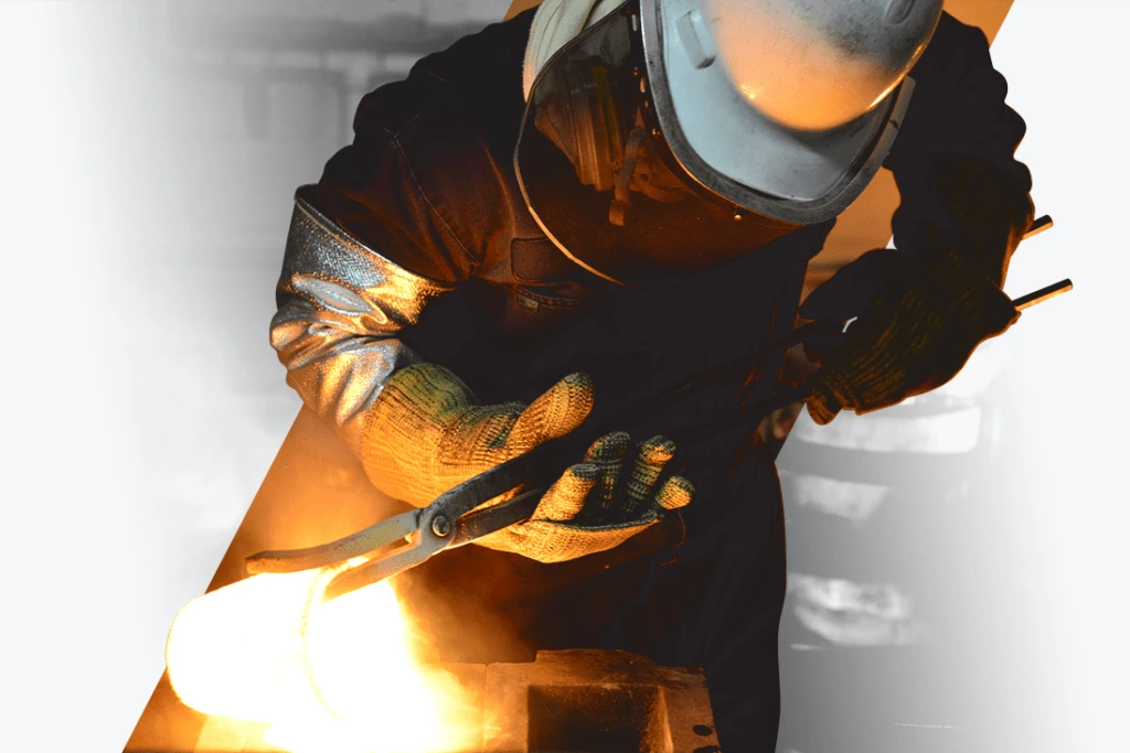 A dental scrap refiner pours liquefied gold into a crucible at Garfield Refining in Philadelphia, PA