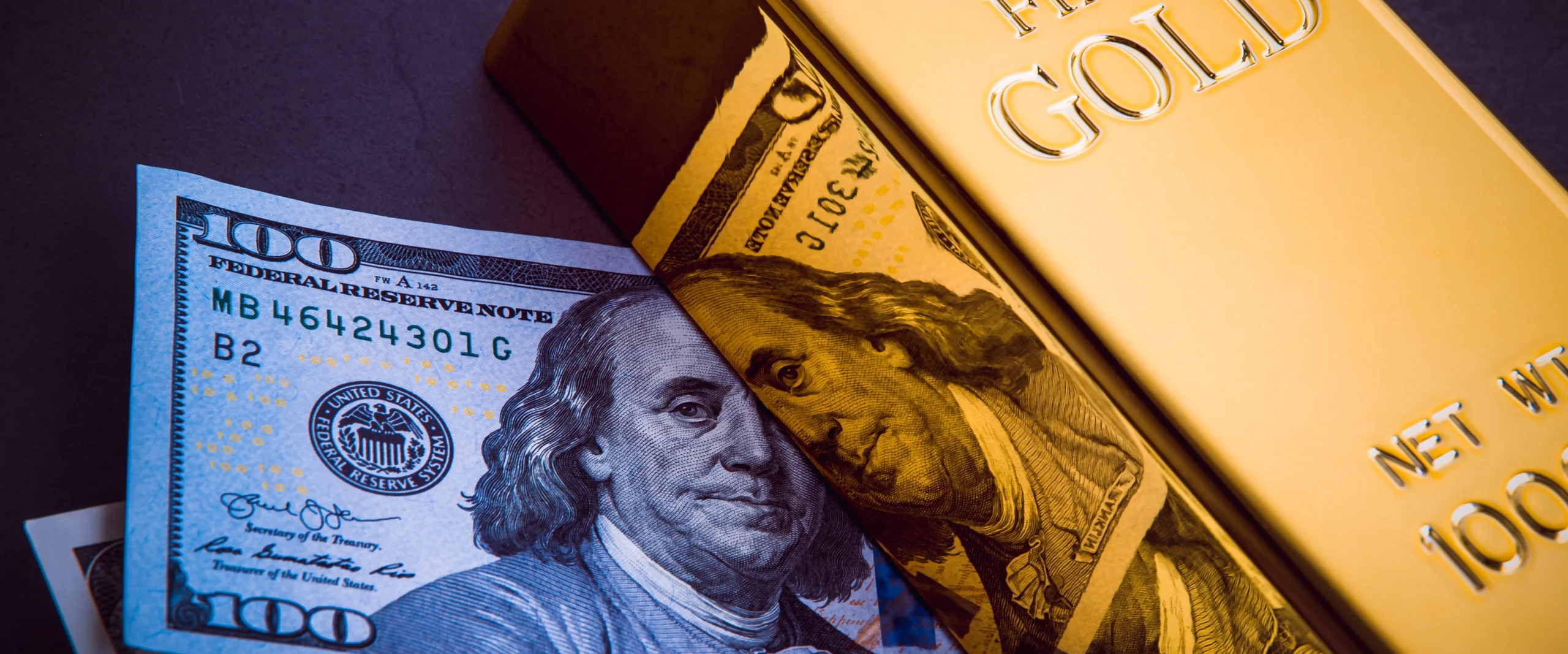 A bar of gold and a hundred-dollar bills