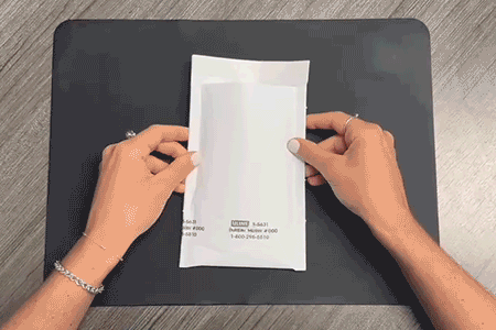 Sealing a prepaid shipping envelope with the Payment Preference Form inside